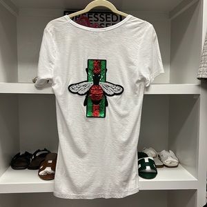 Distressed v-neck tee. Gucci inspired sequin bee print/ribbon decal on back!